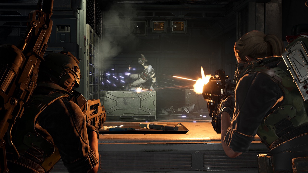 Two Marines engage a synthetic over a barricade